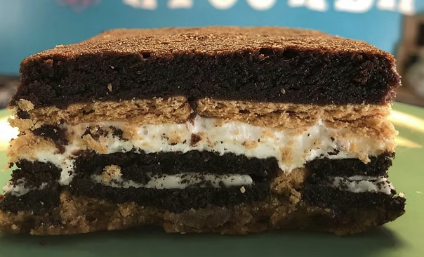 Layered brownie bar with cookie, marshmallow cream, and chocolate sandwich cookie layers