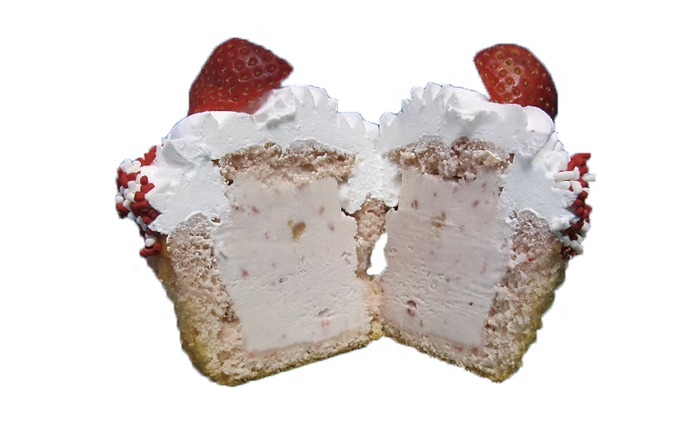 Strawberry ice cream cupcake cut in half showing strawberry ice cream center and fresh strawberries on top