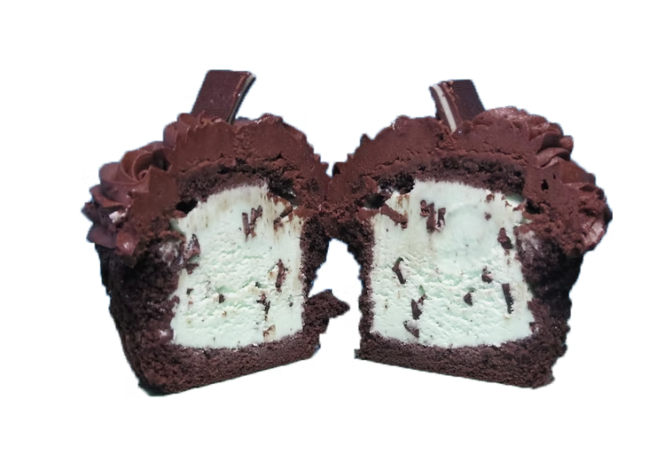 Mesmerizing Mint ice cream cupcake cut in half showing mint chocolate chip ice cream center